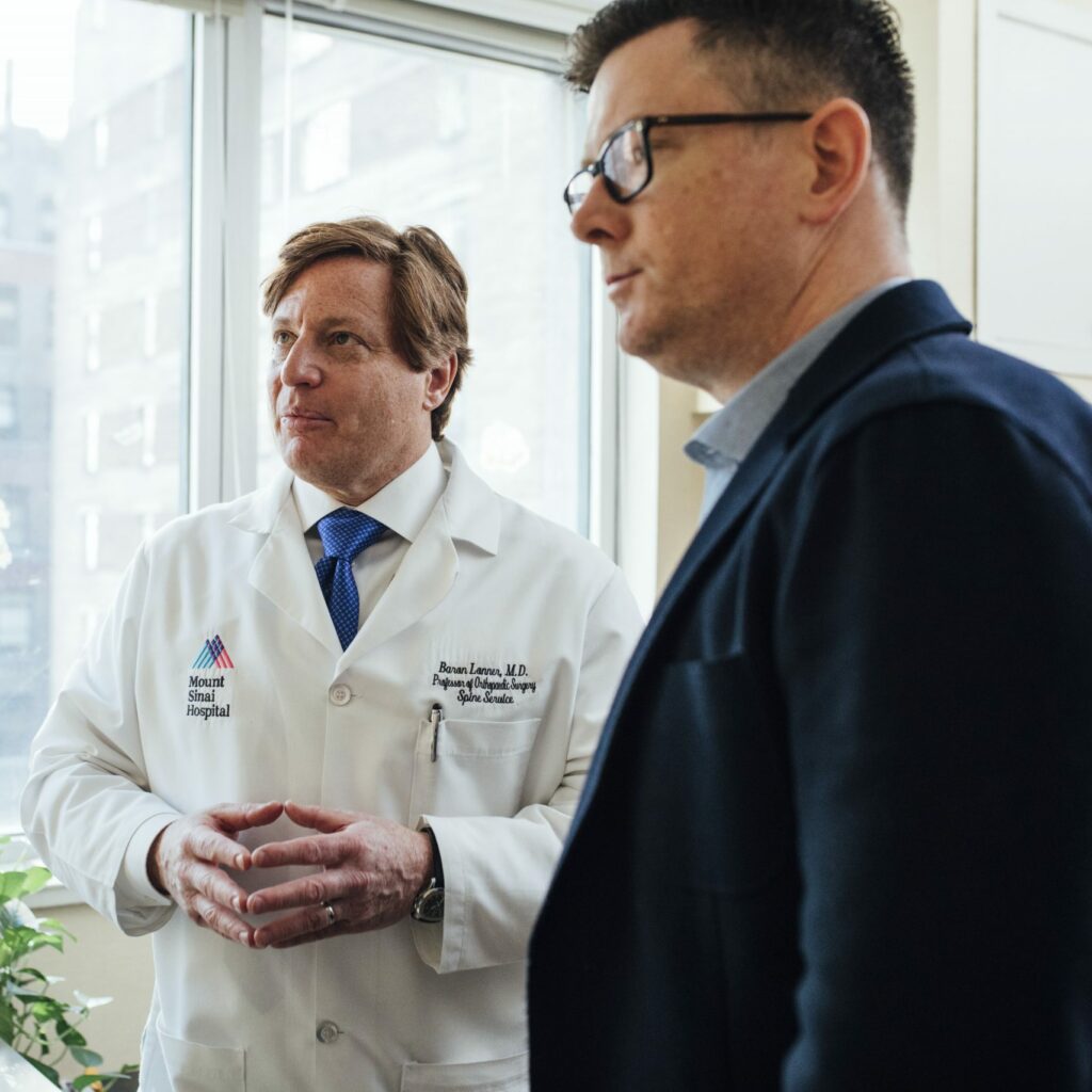 doctor and business man having a conversation