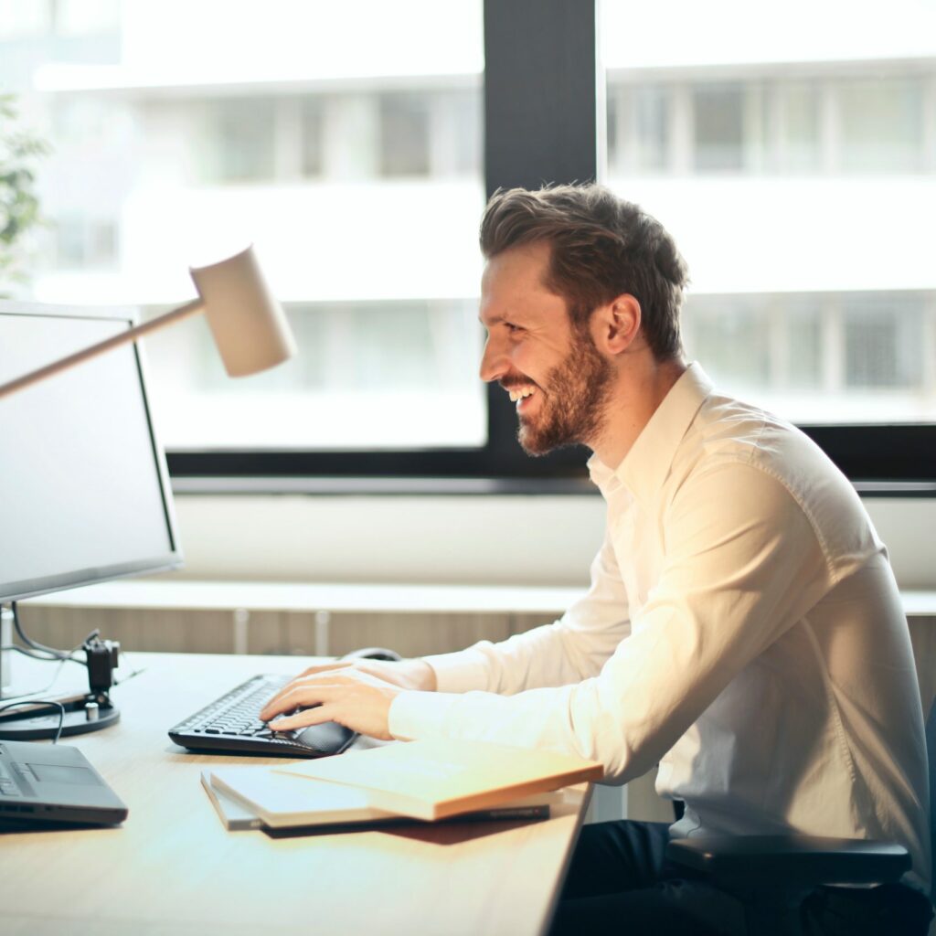 smiling man working in the office
