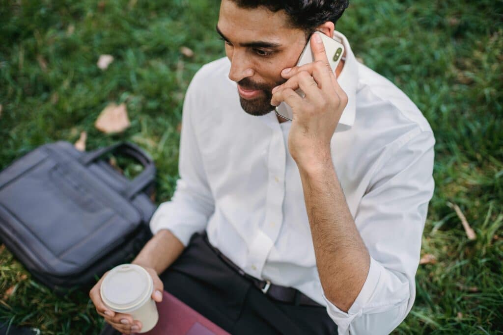 A guy in suit is talking on phone